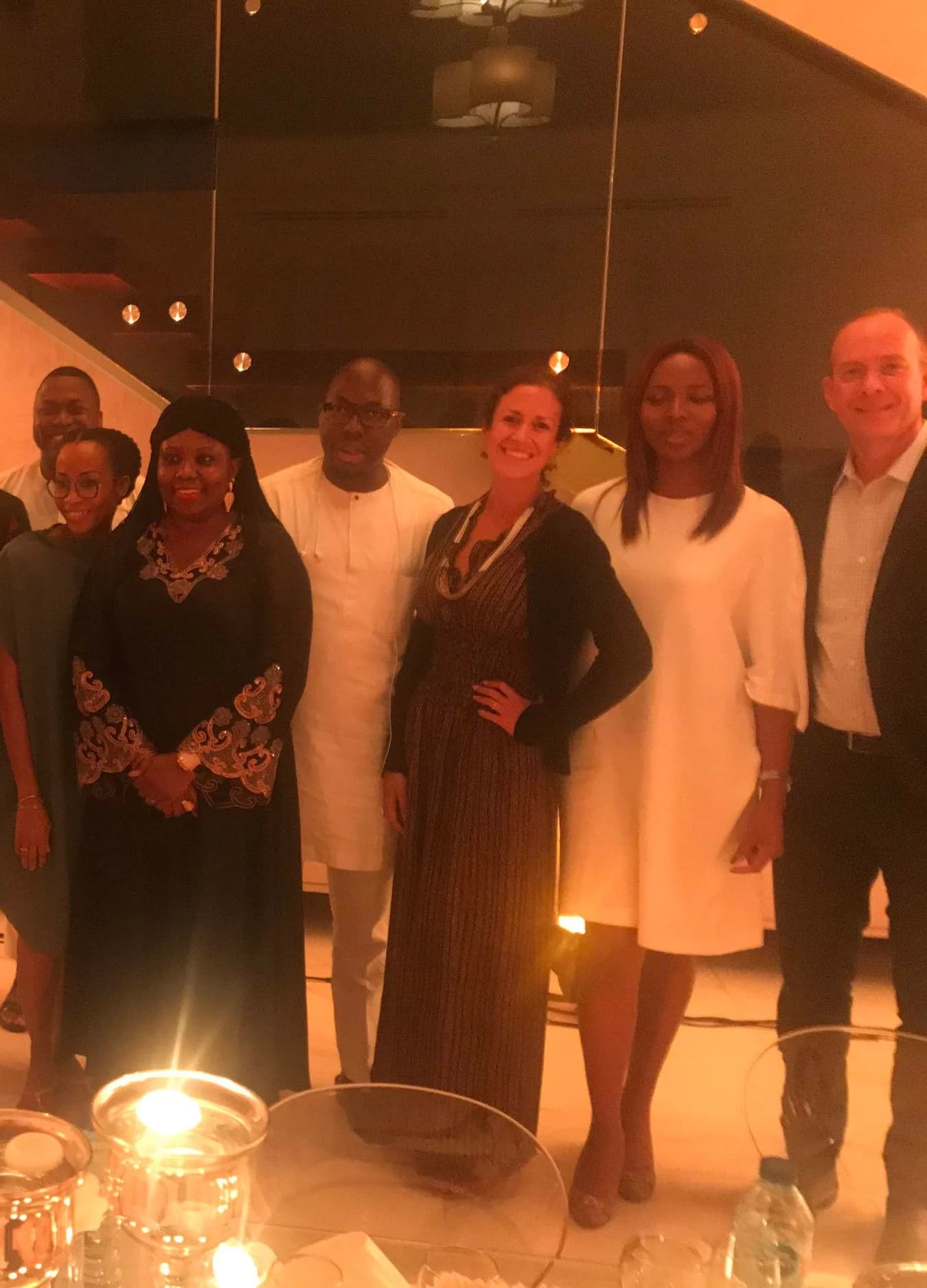 Geoffrey Kirkman speaking at a dinner in Lagos, guests seated around the table